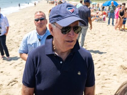 US President Joe Biden speaks with reporters as he walks on the beach in Rehoboth Beach, Delaware, June 20, 2022. (Photo by SAUL LOEB / AFP) (Photo by SAUL LOEB/AFP via Getty Images)