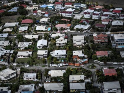 An aerial view shows houses in a residential area, some with swimming pools, on the French Caribbean island of Martinique, on June 15, 2022. (Photo by STEPHANE DE SAKUTIN / AFP) (Photo by STEPHANE DE SAKUTIN/AFP via Getty Images)