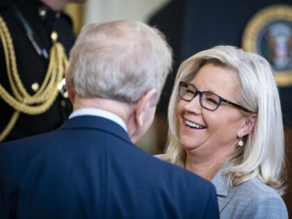 Former Senator Joe Lieberman speaks with Representative Liz Cheney, a Republican from Wyoming, right, ahead of a Presidential Medal of Freedom ceremony with US President Joe Biden, not pictured, in the East Room of the White House in Washington, D.C., US, on Thursday, July 7, 2022. The Presidential Medal of …
