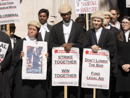 Barristers continue their strike action with a protest outside the Supreme Court in Parliament Square over poor working conditions and low pay due to an insufficient increase in Legal Aid fees, on 11th July 2022, in London, England. Those protesting and not attending courts across England and Wales could face …