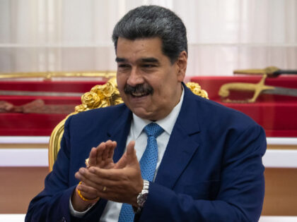 Nicolas Maduro, Venezuela's president, applauds during a news conference at Miraflores Palace in Caracas, Venezuela, on Monday, July 11, 2022. Maduro said that Venezuela and Turkey plan to expand trade between the two countries from $850 million to $3 billion in 2022. Photographer: Gaby Oraa/Bloomberg via Getty Images