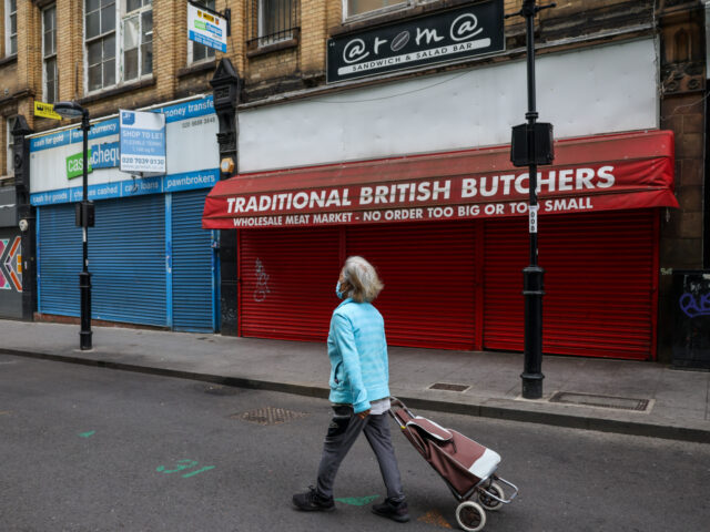 A shopper passes closed and shuttered shops in Croydon, UK, on Monday, July 25, 2022. UK inflation running at the fastest pace since the early 80s. Photographer: Hollie Adams/Bloomberg via Getty Images