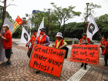 Pro-China demonstrators protest outside the Grand Hyatt hotel ahead of the arrival of US House Speaker Nancy Pelosi in Taipei, Taiwan, on Tuesday, Aug. 2, 2022. Pelosi is expected to land in Taiwan on Tuesday evening in defiance of Chinese threats, a trip that would make her the highest-ranking American …