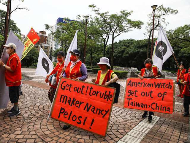 Pro-China demonstrators protest outside the Grand Hyatt hotel ahead of the arrival of US House Speaker Nancy Pelosi in Taipei, Taiwan, on Tuesday, Aug. 2, 2022. Pelosi is expected to land in Taiwan on Tuesday evening in defiance of Chinese threats, a trip that would make her the highest-ranking American politician to visit the island in 25 years. Photographer: I-Hwa Cheng/Bloomberg