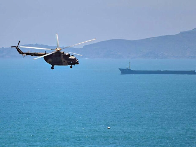 A Chinese military helicopter flies past Pingtan island, one of mainland China's clos