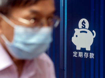 An advertisement for bank services outside a bank branch in Hong Kong, China, on Thursday,