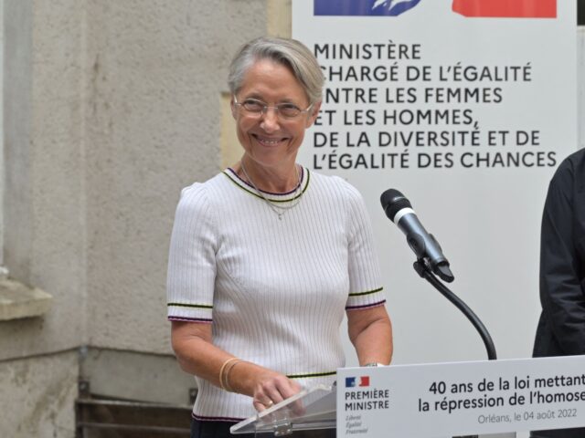 France's Prime Minister Elisabeth Borne (L) delivers a speech next to French Minister for