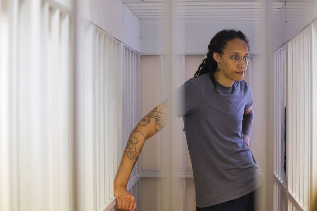 Brittney Griner, a U.S. Women's National Basketball Association (WNBA) basketball player, was detained at Moscow's Sheremetyevo Airport during a hearing in Khimki outside Moscow on Aug. 4 and was later arrested Charged with illegal marijuana possession, she awaits sentencing in defendant's cage, 2022. - A Russian court has found Griner guilty of drug smuggling and storage after prosecutors called for a nine-and-a-half-year prison term for the athlete.  (Photo by EVGENIA NOVOZHENINA/POOL/AFP) (Photo by EVGENIA NOVOZHENINA/POOL/AFP via Getty Images)