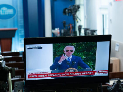 US President Joe Biden displayed on a television monitor in the James S. Brady Press Briefing Room while speaking at the White House in Washington, D.C, US, on Friday, Aug. 5, 2022. Biden in a statement today said the unemployment rate falling to pre-pandemic lows was "the result of my …