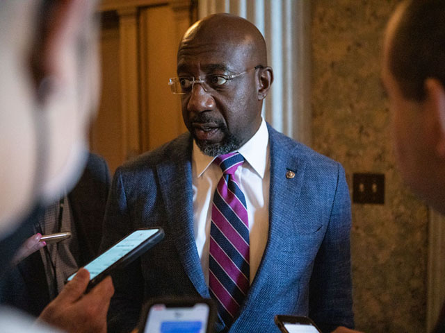 WASHINGTON, DC - AUGUST 6: Sen. Raphael Warnock (D-Ga.) speaks to reporters as he departs a vote on the Senate floor on Capitol Hill on August 6, 2022 in Washington, DC. The U.S. Senate plans to work through the weekend to vote on amendments to the Inflation Reduction Act, expected to conclude on Sunday, August 7, 2022. (Photo by Anna Rose Layden/Getty Images)