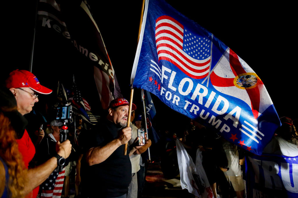 Supporters of former President Donald Trump rally near the home of former President Donald Trump at Mar-A-Lago on August 8, 2022 in Palm Beach, Florida. The FBI raided the home to retrieve classified White House documents. 