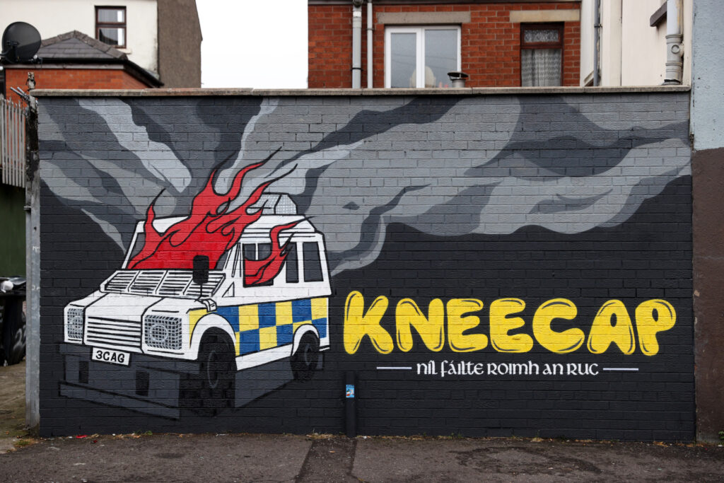 rish language rap group Kneecap's mural of a burning police Land Rover on Hawthorn Street in Belfast. There have been calls for political leadership after a series of incidents across the weekend, including pro-IRA chants at a concert in west Belfast. The Wolfe Tones played their annual gig to close Feile an Phobail in west Belfast on Sunday evening. Picture date: Monday August 15, 2022. (Photo by Liam McBurney/PA Images via Getty Images)