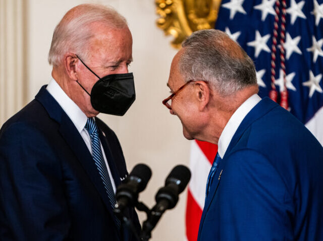 WASHINGTON, DC August 16, 2022: US President Joe Biden and Senate Majority Leader Chuck Schumer (D-NY) before the signing into law H.R. 5376, the Inflation Reduction Act of 2022 (climate change and health care bill) in the State Dining Room of the White House on Tuesday August 16, 2022. From …