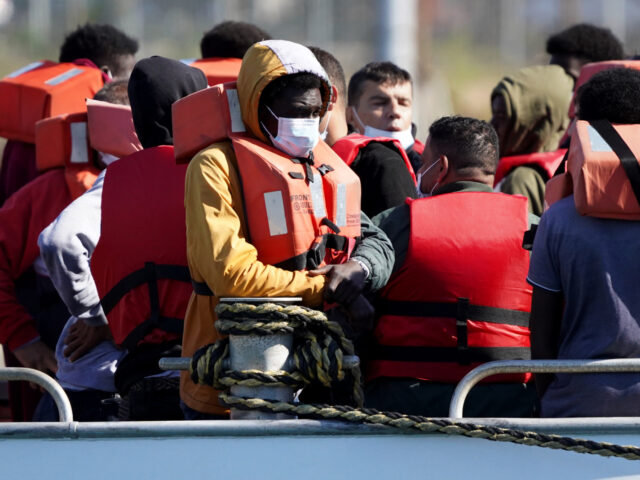 A group of people thought to be migrants are brought in to Dover, Kent, from a Border Force Vessel, following a small boat incident in the Channel. Picture date: Tuesday August 23, 2022. (Photo by Gareth Fuller/PA Images via Getty Images)
