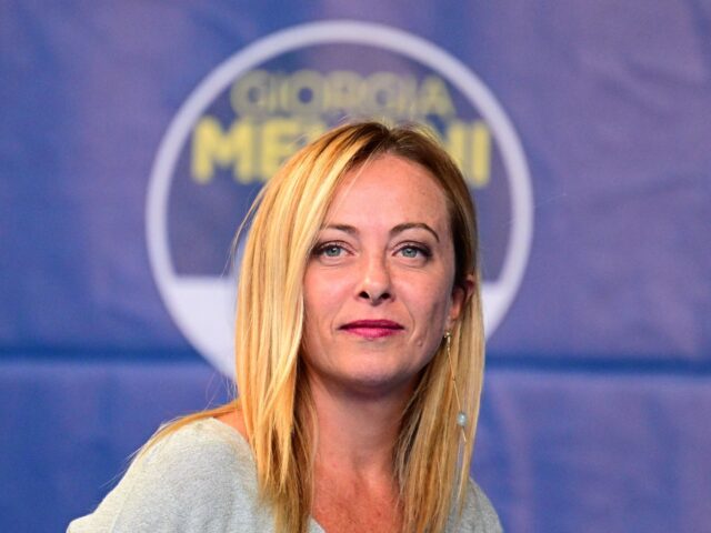 Leader of Italian far-right party Fratelli d'Italia (Brothers of Italy) Giorgia Meloni arrives to address supporters during a rally to launch her campaign for general elections, in Ancona, central Italy, on August 23, 2022. - Italians head to the polls for general elections on September 25, 2022. Opinion polls put …