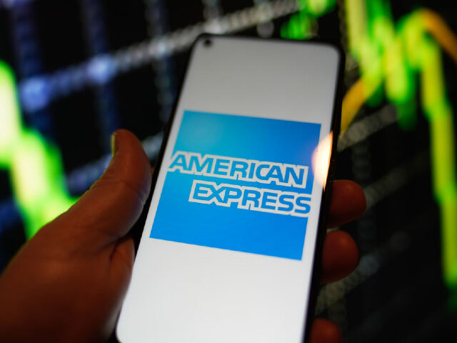 The American Express logo is seen on a Redmi phone screen in this photo illustration in Warsaw, Poland on 23 August, 2022. (Photo by STR/NurPhoto via Getty Images)