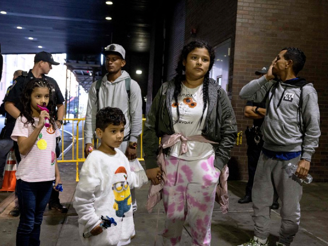 A group of migrants, who boarded a bus in Texas, arrive at the New York Port Authority Bus Terminal on August 25, 2022. - Since April, Texas Governor Greg Abbott has ordered that buses transport thousands of migrants from Texas to Washington, DC, and New York to highlight criticism of US President Joe Bidens' border policy.  (Photo by Yuki IWAMURA/AFP) (Photo by YUKI IWAMURA/AFP via Getty Images)
