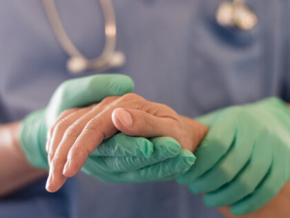 Surgeon, physician performs surgical operations, anesthetist or anesthesiologist holding p