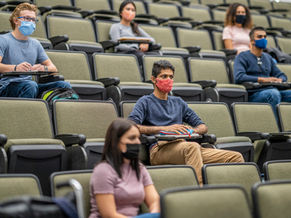 University students wearing masks in lecture hall