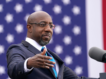 U.S. Democratic Senate candidate Raphael Warnock delivers remarks during a campaign rally with U.S. President-elect Joe Biden at Pullman Yard on December 15, 2020 in Atlanta, Georgia. Biden’s stop in Georgia comes less than a month before the January 5 runoff election for Senate candidates Warnock and Ossoff as they …