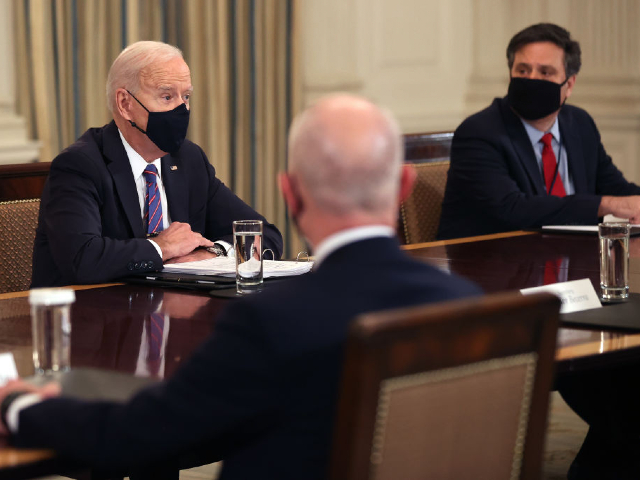 WASHINGTON, DC - MARCH 24: U.S. President Joe Biden (L) and Chief of Staff Ron Klain meet with cabinet members and immigration advisors in the State Dining Room on March 24, 2021 in Washington, DC. With the number of migrants apprehended at the U.S.-Mexico border reaching a two-decade high, Biden announced that Vice President Kamala Harris will be leading the White House efforts to handle the crisis at the border. (Photo by Chip Somodevilla/Getty Images)