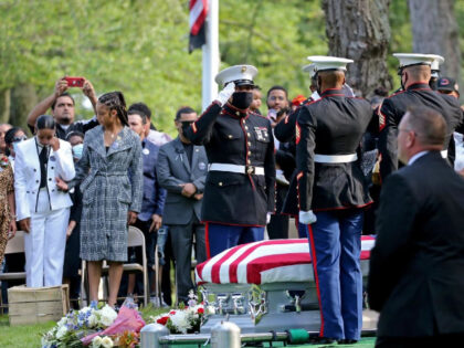 Lawrence, MA - September 14: Marine Honor Guard salute after placing the casket at the pub