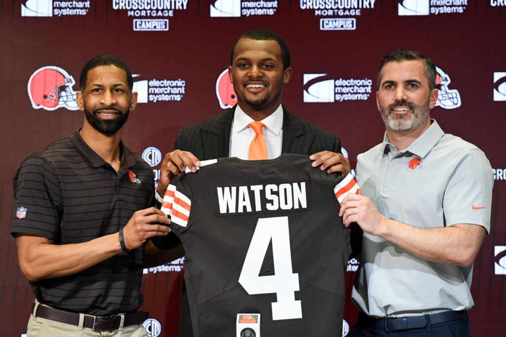Quarterback Deshaun Watson #4 of the Cleveland Browns is introduced by general manager Andrew Berry (L) and head coach Kevin Stefanski during a press conference at CrossCountry Mortgage Campus on March 25, 2022 in Berea, Ohio. (Photo by Nick Cammett/Getty Images)