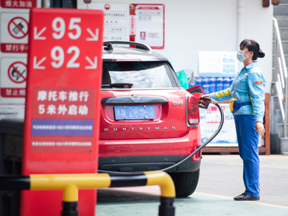 An employee refuels a vehicle at a gas station of China National Petroleum Corporation (PetroChina) on June 28, 2022 in Nanjing, Jiangsu Provine of China. (Photo by Su Yang/VCG via Getty Images)