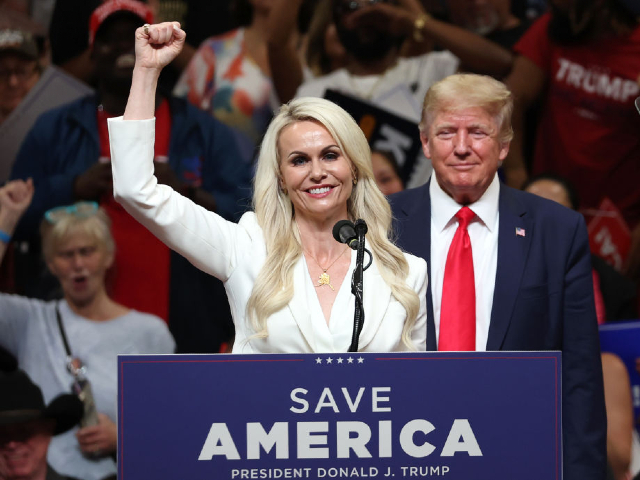 ANCHORAGE, ALASKA - JULY 09: Republican U.S. Senate candidate Kelly Tshibaka (L) pumps her fist as former U.S. President Donald Trump (R) looks on during a "Save America" rally at Alaska Airlines Center on July 09, 2022 in Anchorage, Alaska. Former President Donald Trump held a "Save America" rally in Anchorage where he campaigned with U.S. House candidate former Alaska Gov. Sarah Palin and U.S. Senate candidate Kelly Tshibaka. (Photo by Justin Sullivan/Getty Images)