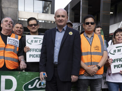 LONDON, UNITED KINGDOM - JULY 27: A picket line is joined by Mick Lynch, Secretary-General of the National Union of Rail, Maritime and Transport Workers, (centre) Euston station on July 27, 2022 in London, United Kingdom. Around 40,000 RMT rail workers will walk out for the second round of train …