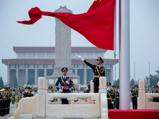 BEIJING, CHINA - AUGUST 01: The Guard of Honor of the Chinese People's Liberation Army (PLA) performs a flag-raising ceremony at Tian'anmen Square on China's Army Day on August 1, 2022 in Beijing, China. (Photo by VCG/VCG via Getty Images)