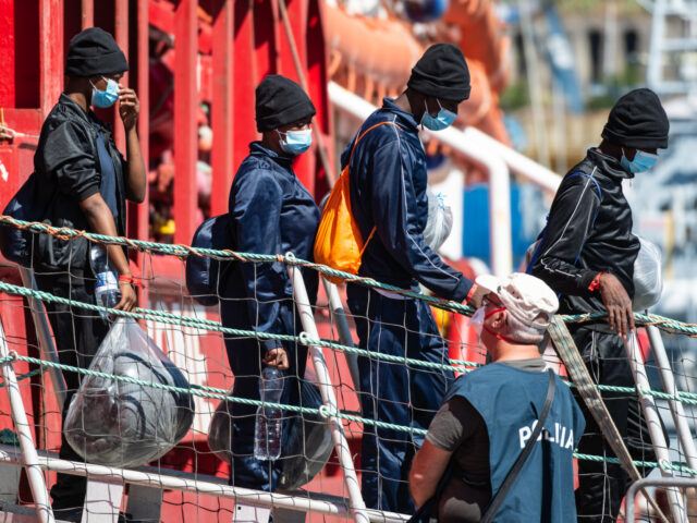 SALERNO, ITALY - AUGUST 01: People disembark from the Ocean Viking ship on August 01, 2022 in Salerno, Italy. The Ocean Viking, rescue ship of French NGO SOS Mediterranee, received authorization to dock with 380 migrants on board in the port of Salerno, south of Naples. (Photo by Ivan Romano/Getty …