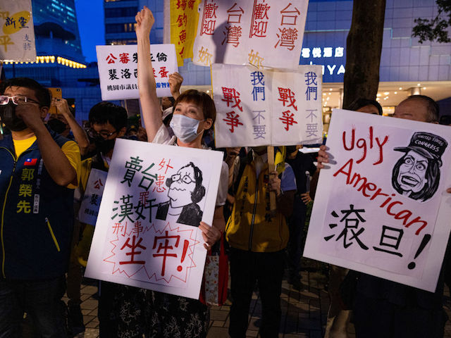 TAIPEI, TAIWAN - AUGUST 02: Demonstrators take part in a protest against Speaker of the House Nancy Pelosi's (D-CA) visit on August 02, 2022 in Taipei, Taiwan. Pelosi arrived in Taiwan as part of a tour of Asia aimed at reassuring allies in the region, as China made it clear that her visit to Taiwan would be seen in a negative light. (Photo by Annabelle Chih/Getty Images)