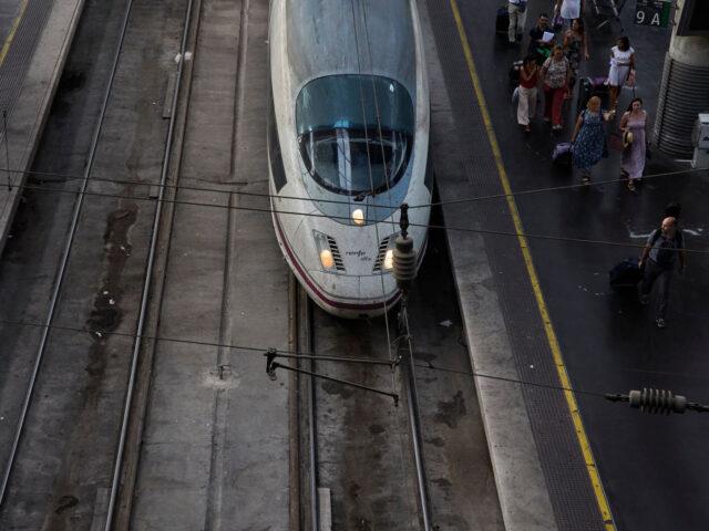 MADRID, SPAIN - AUGUST 03: Several people on the AVE platform at Puerta de Atocha station