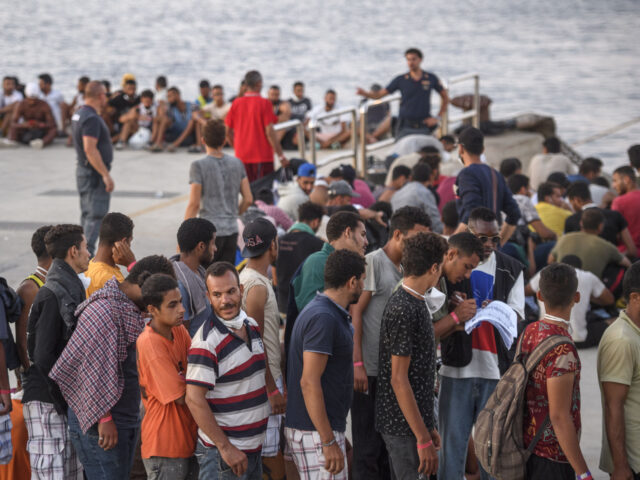 LAMPEDUSA, ITALY - 03: Migrants wait to board the Coast Guard ship "Diciotti" be