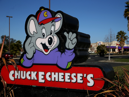 A sign is posted in front of a Chuck E. Cheese restaurant on January 16, 2014 in Newark, C
