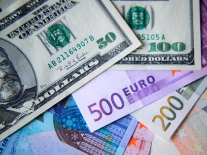 Euro and dollar notes - stock photo