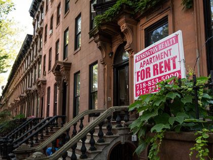 A sign advertises an apartment for rent along a row of brownstone townhouses in the Fort Greene neighborhood on June 24, 2016 in the Brooklyn borough of New York City. According to a survey released on Thursday by real-estate firm RealtyTrac, Brooklyn ranked as the most unaffordable place to live …