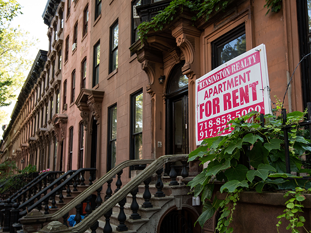 A sign advertises an apartment for rent along a row of brownstone townhouses in the Fort Greene neighborhood on June 24, 2016 in the Brooklyn borough of New York City. According to a survey released on Thursday by real-estate firm RealtyTrac, Brooklyn ranked as the most unaffordable place to live …