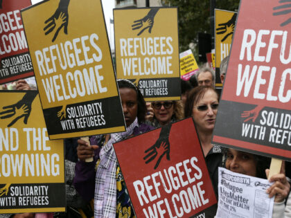 Demonstrators gather for a march calling for the British parliament to welcome refugees in the UK in central London on September 17, 2016. - Thousands marched in central London calling on the British government to do more to help refugees fleeing conflict and persecution. (Photo by Daniel LEAL / AFP) …