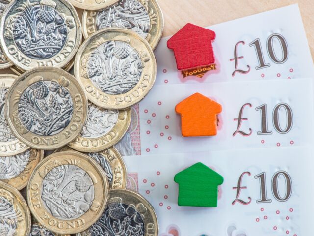 Colourful (red, amber and green) model homes on £10 notes and alongside newly minted poun