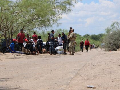 A group of migrants surrender to Texas National Guard Soldiers near Eagle Pass, Texas. (Randy Clark/Breitbart Texas)