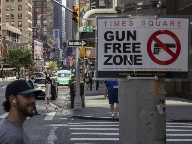 A sign reading Gun Free Zone is seen around Times Square, Wednesday, August 31, 2022, in N