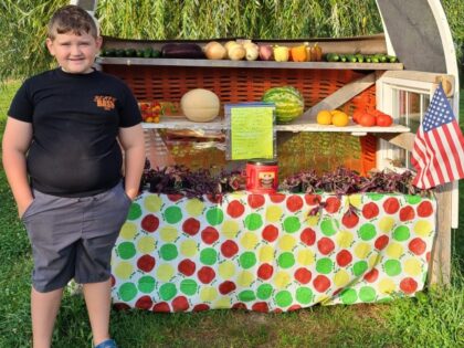 John-Like Radle stands in front of his produce stand. (Stacey Radle)