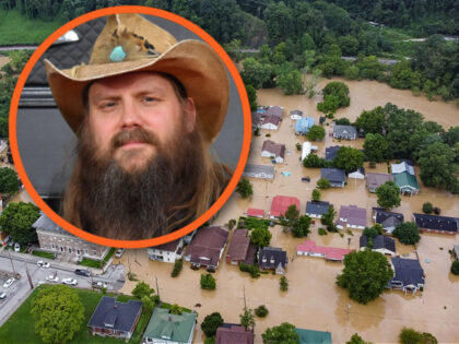 Aerial view of homes submerged under flood waters from the North Fork of the Kentucky River in Jackson, Kentucky, on July 28, 2022. - Flash flooding caused by torrential rains has killed at least eight people in eastern Kentucky and left some residents stranded on rooftops and in trees, the …