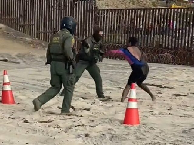 Two Border Patrol agents from San Diego work to arrest an assaultive migrant. (U.S. Rep. M