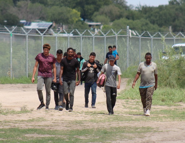 With no Border Patrol agents available, a group of migrants surrender to Texas National Guard soldiers. (Randy Clark/Breitbart Texas)