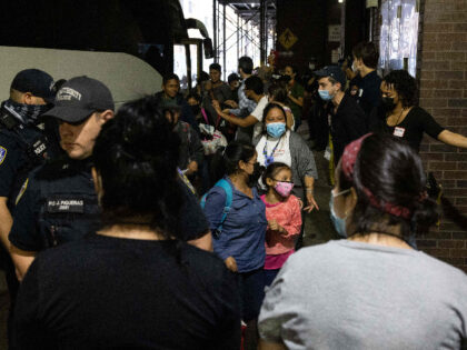A bus carrying migrants from Texas arrives at Port Authority Bus Terminal on August 10, 2022 in New York. - Texas has sent thousands of migrants from the border state into Washington, DC, New York City, and other areas. (Photo by Yuki IWAMURA / AFP) (Photo by YUKI IWAMURA/AFP via …
