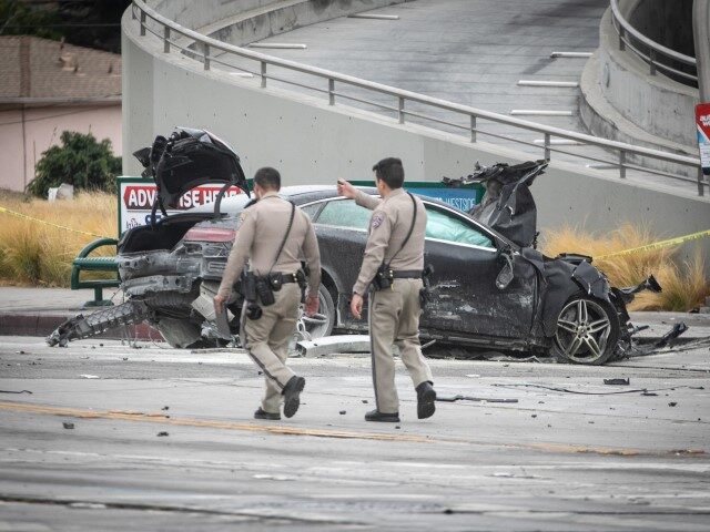LOS ANGELES, CA - AUGUST 04: CHP and other officials investigate a fiery crash where multi
