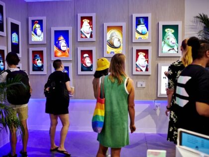 Customers view an NFT gallery featuring "Degen Apes" at the Solana Space retail store at Hudson Yards in New York, US, on Monday, Aug. 8, 2022. Mikkel Morch, executive director at Digital Asset Investment Fund ARK36, said that he sees the recent efforts with Solanas mobile phone and the Solana …